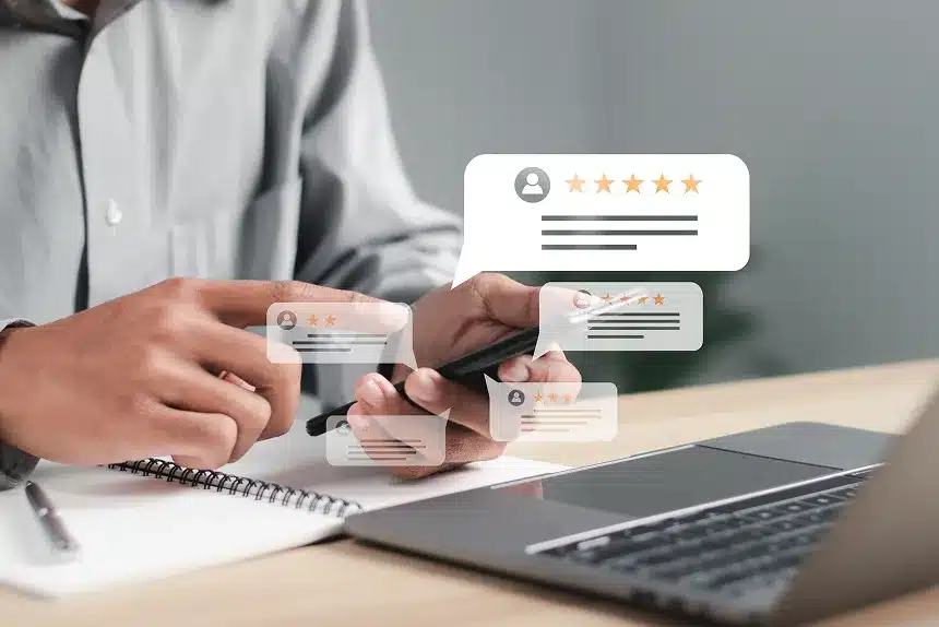 A man holding a smartphone, focused on rating a product on a website.