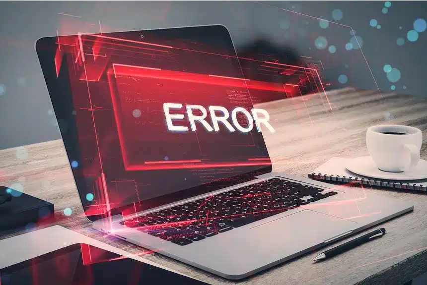 Image showing a person troubleshooting a laptop error, with tools and a laptop open, focused on the screen displaying error messages.