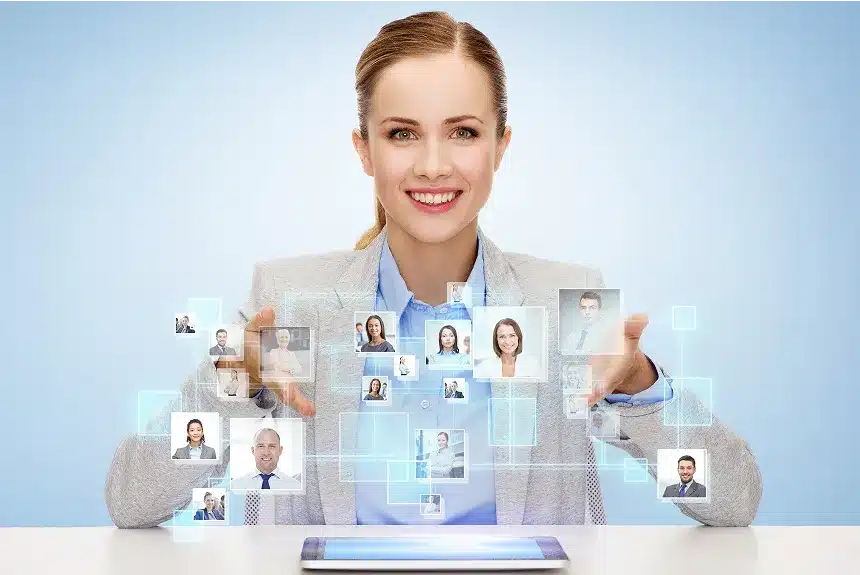A woman in a business suit holds a tablet displaying various icons, suggesting a focus on technology and professionalism.