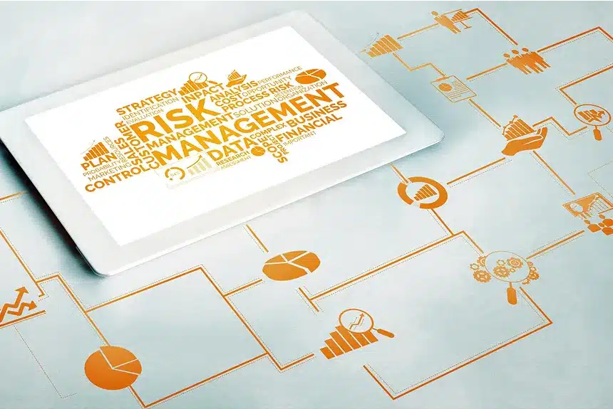 Image illustrating strategies for managing business risk, featuring charts, graphs, and a checklist on a desk.