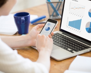 A person using a mobile app on a smartphone to enhance business operations and efficiency.