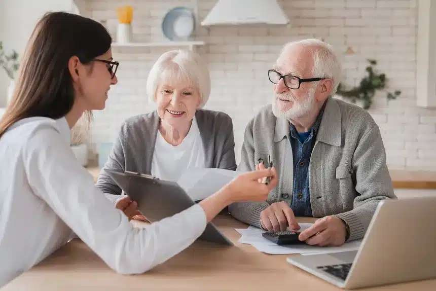 A woman and an older man converse with another woman and man in a casual setting.