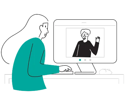 A woman sitting at a desk, focused on using a computer, with a thoughtful expression and a cozy workspace around her.